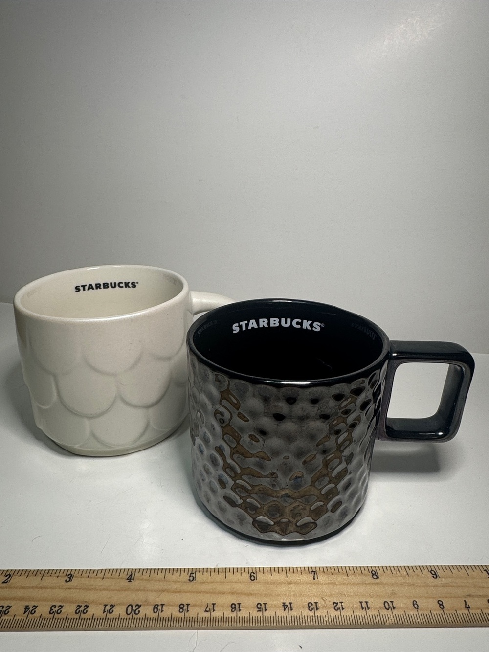 Two Starbucks mugs.  Black and white  fabulous! 14 oz and 12 oz